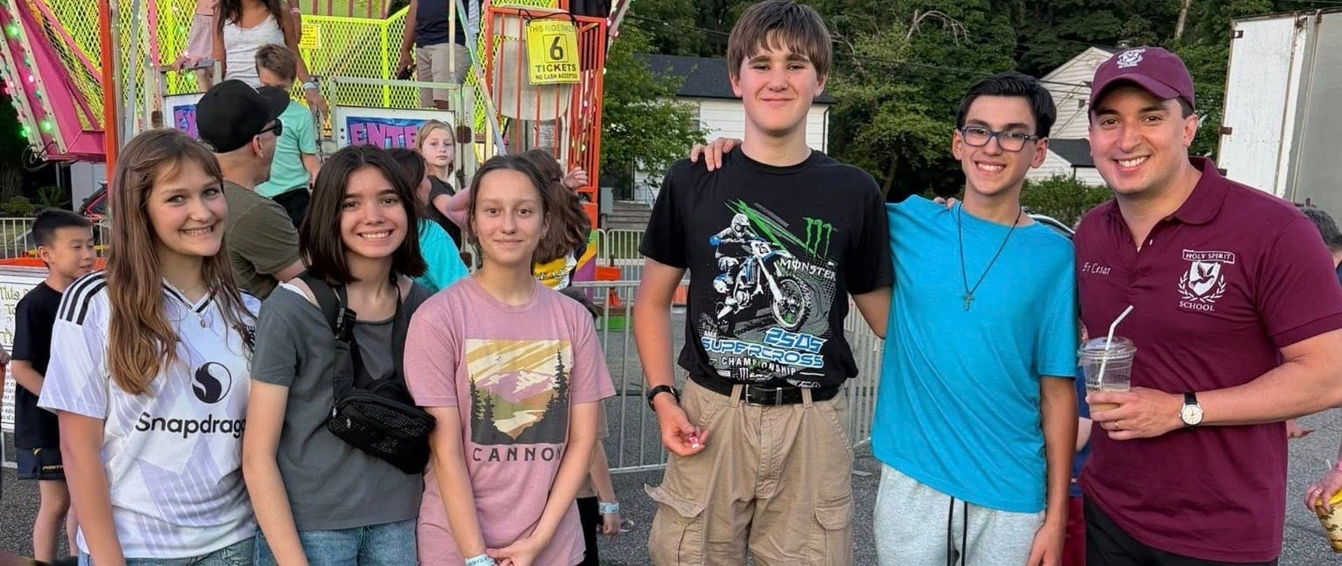 Students and Fr. Cesar at the school carnival
